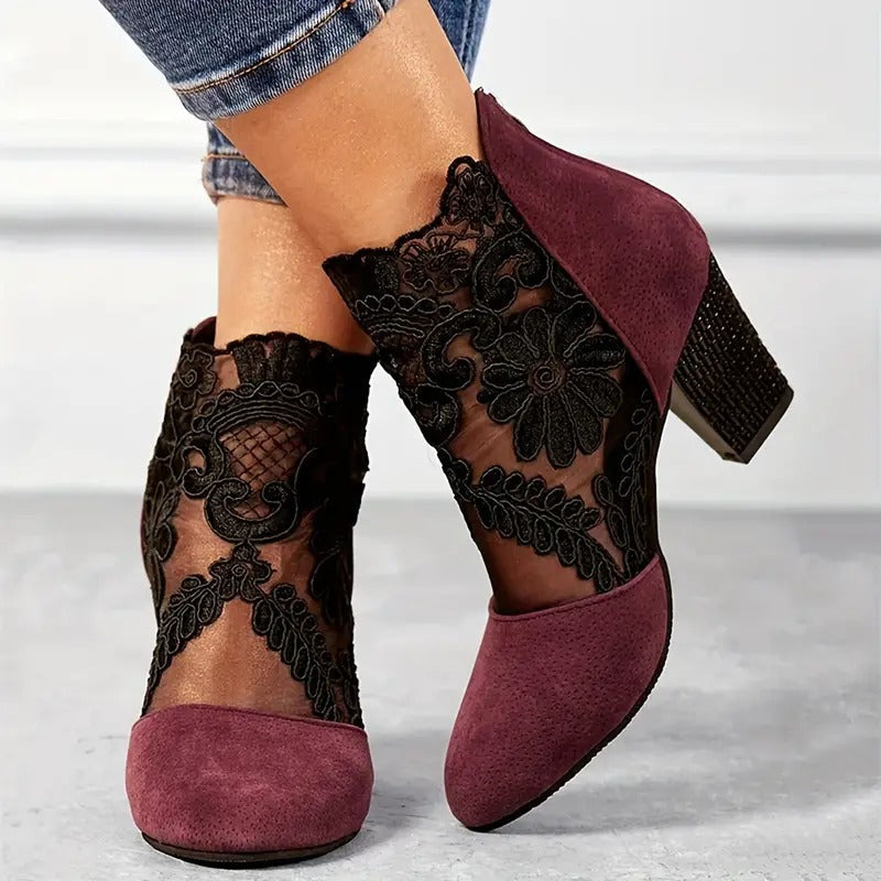 Women's elegant floral lace block heel ankle boots by LAKD, showcasing intricate lace details and stylish ankle height.